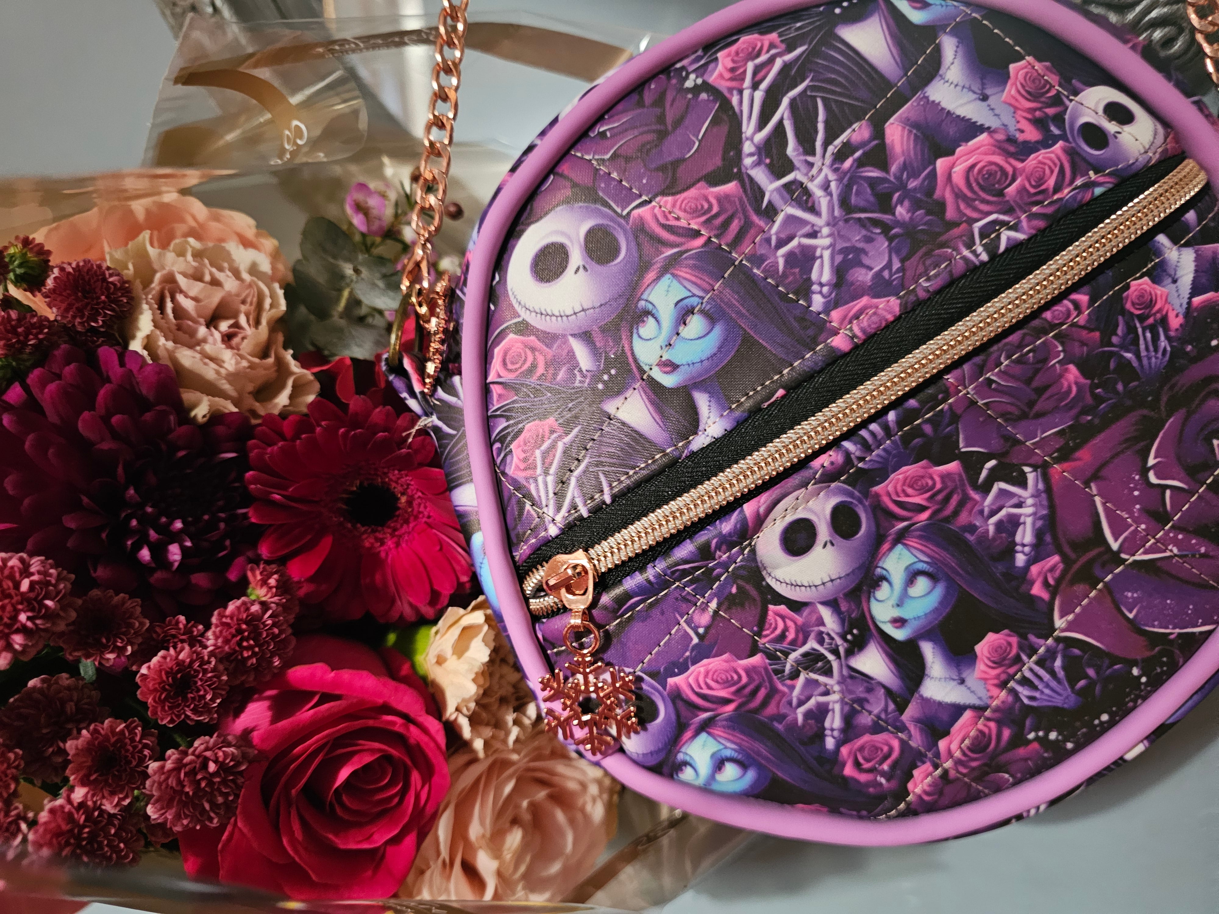 Close-up of structured metal wired piping on a faux leather round bag.