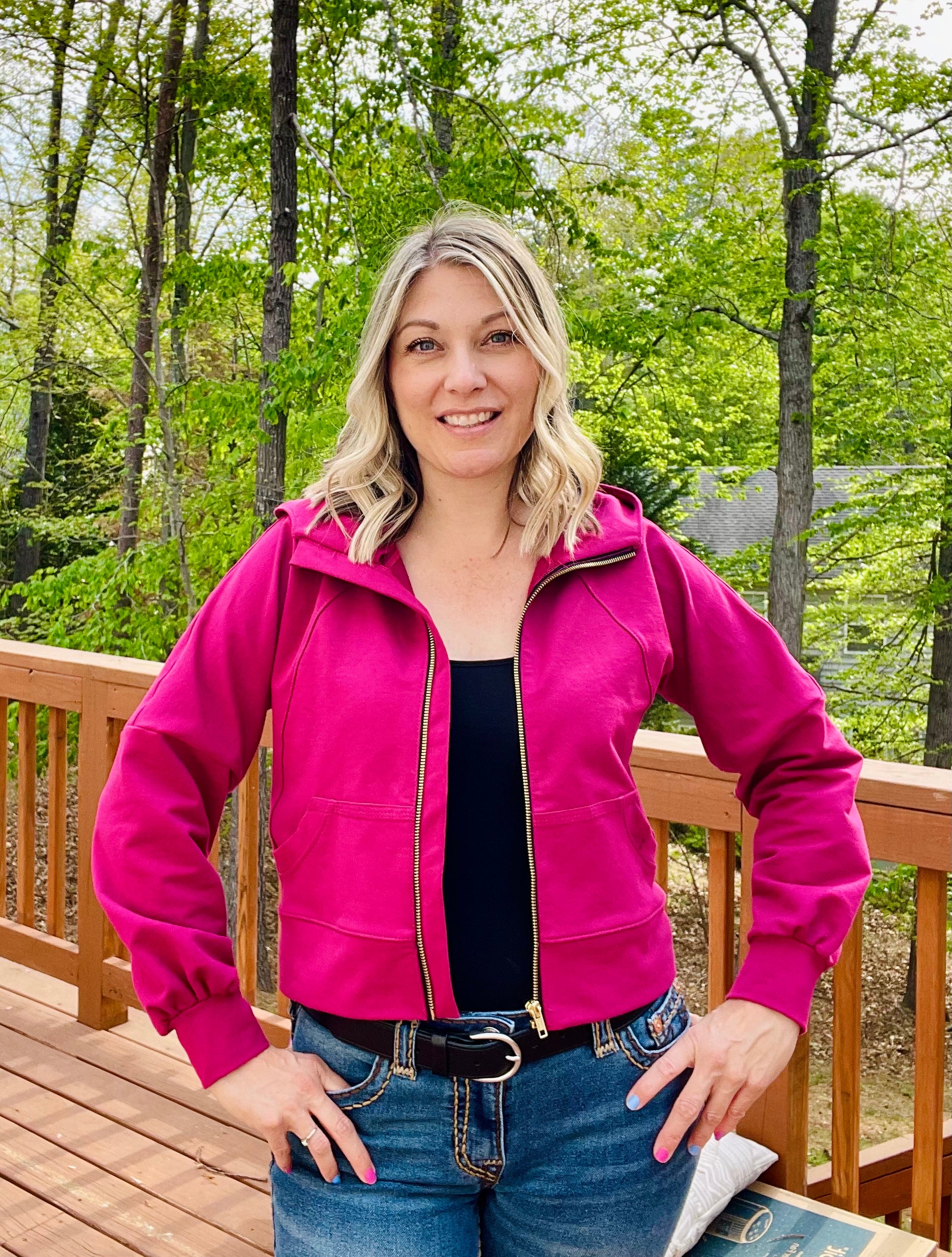 Hot pink french terry fabric hooded athletic jacket with zip closure. bishop raglan dolman sleeves. Cropped version. Ellie and Mac PDF sewing patterns.