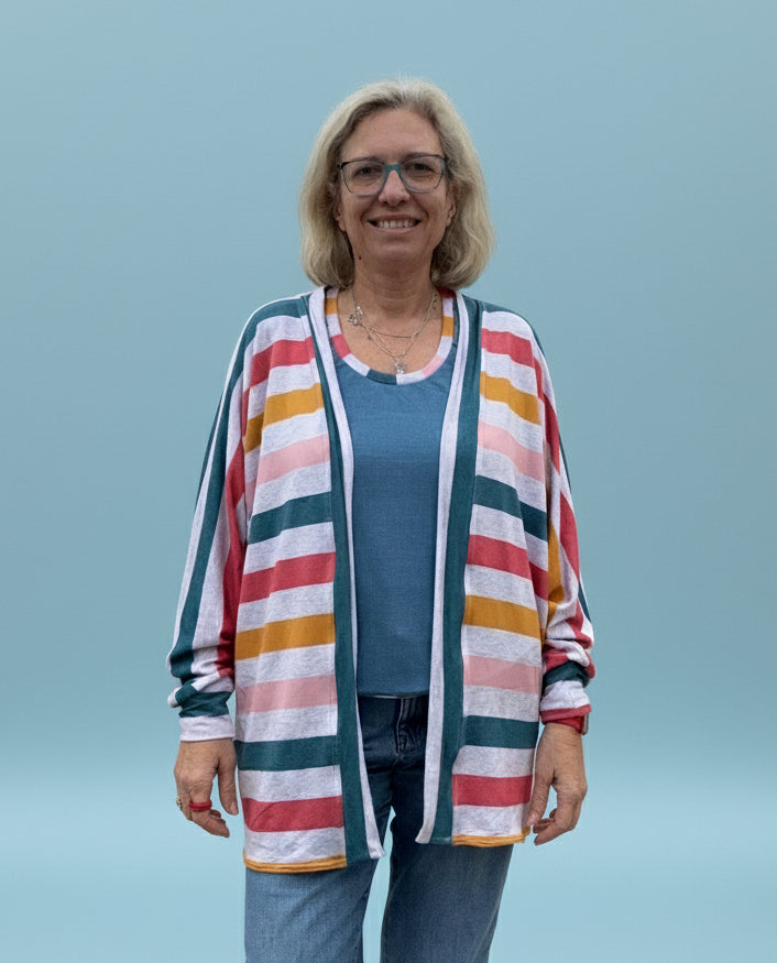 Person wearing a colorful striped sweater batwing cardigan. Easy Sewing patterns for beginners.