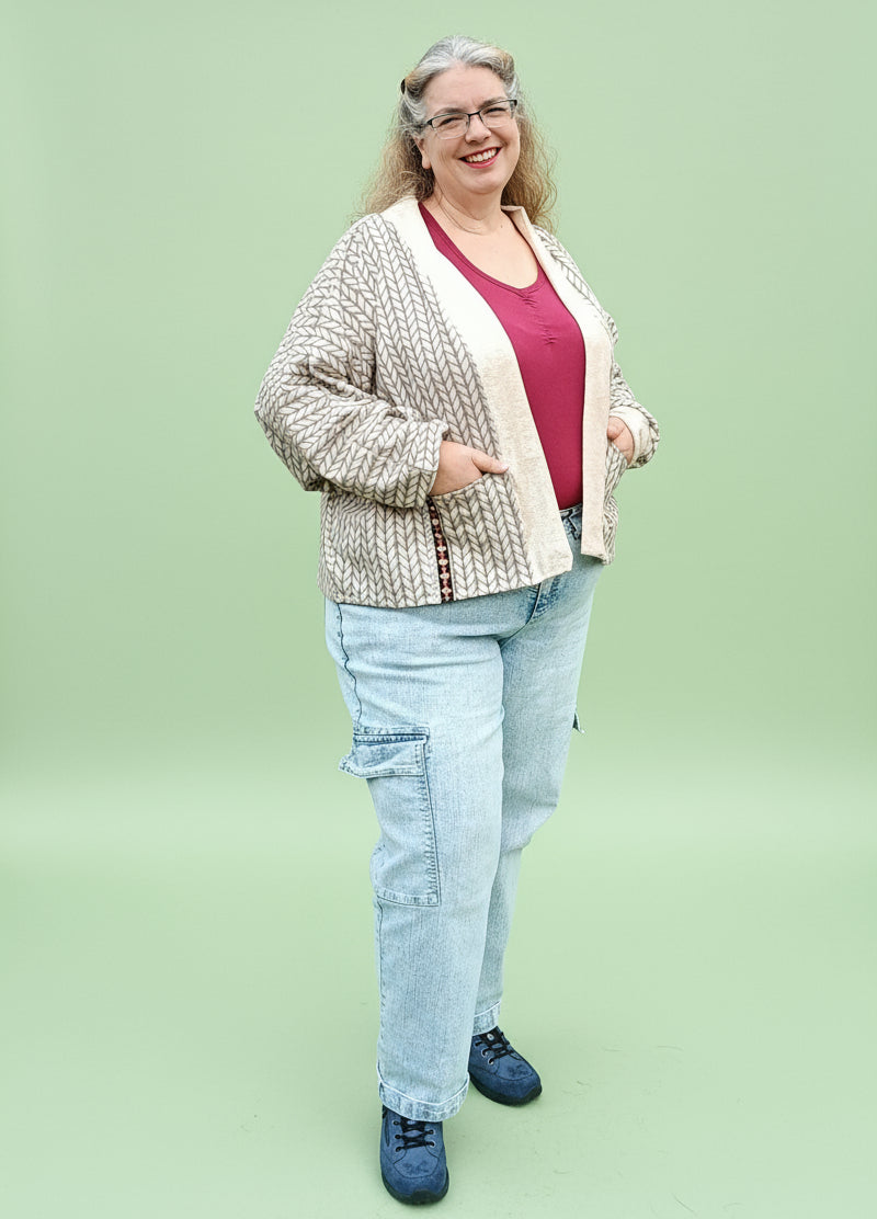 how to sew batwing sleeve on knit cardigan shown by the model in hip length.