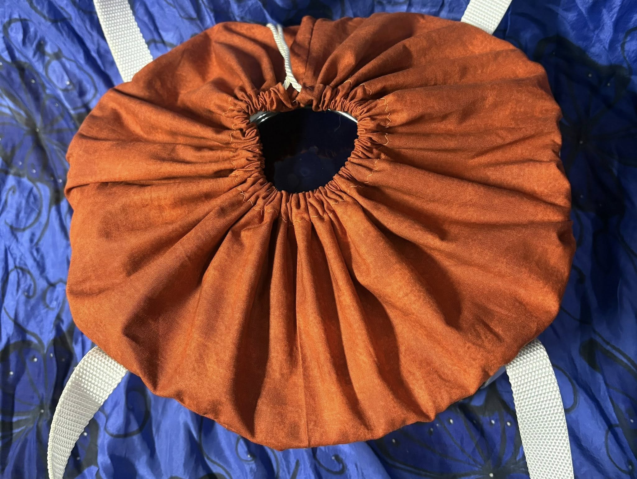 Top of the slow cooker bag. Orange drawstring opening for ease.