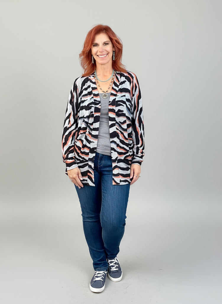Woman wearing a Mid thigh length cardigan PDF sewing pattern for women.