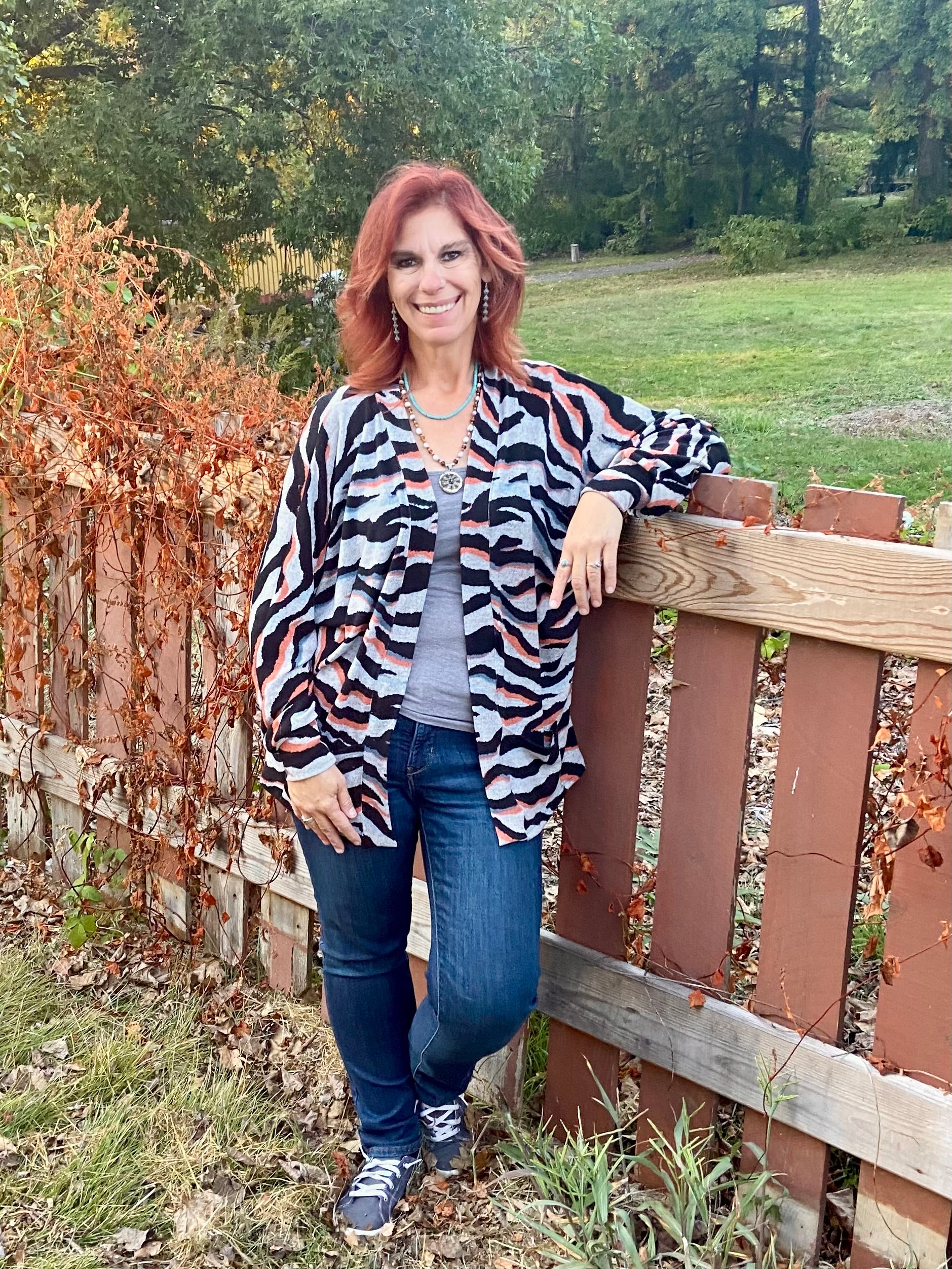 Woman wearing a Mid thigh length cardigan PDF sewing pattern for women.