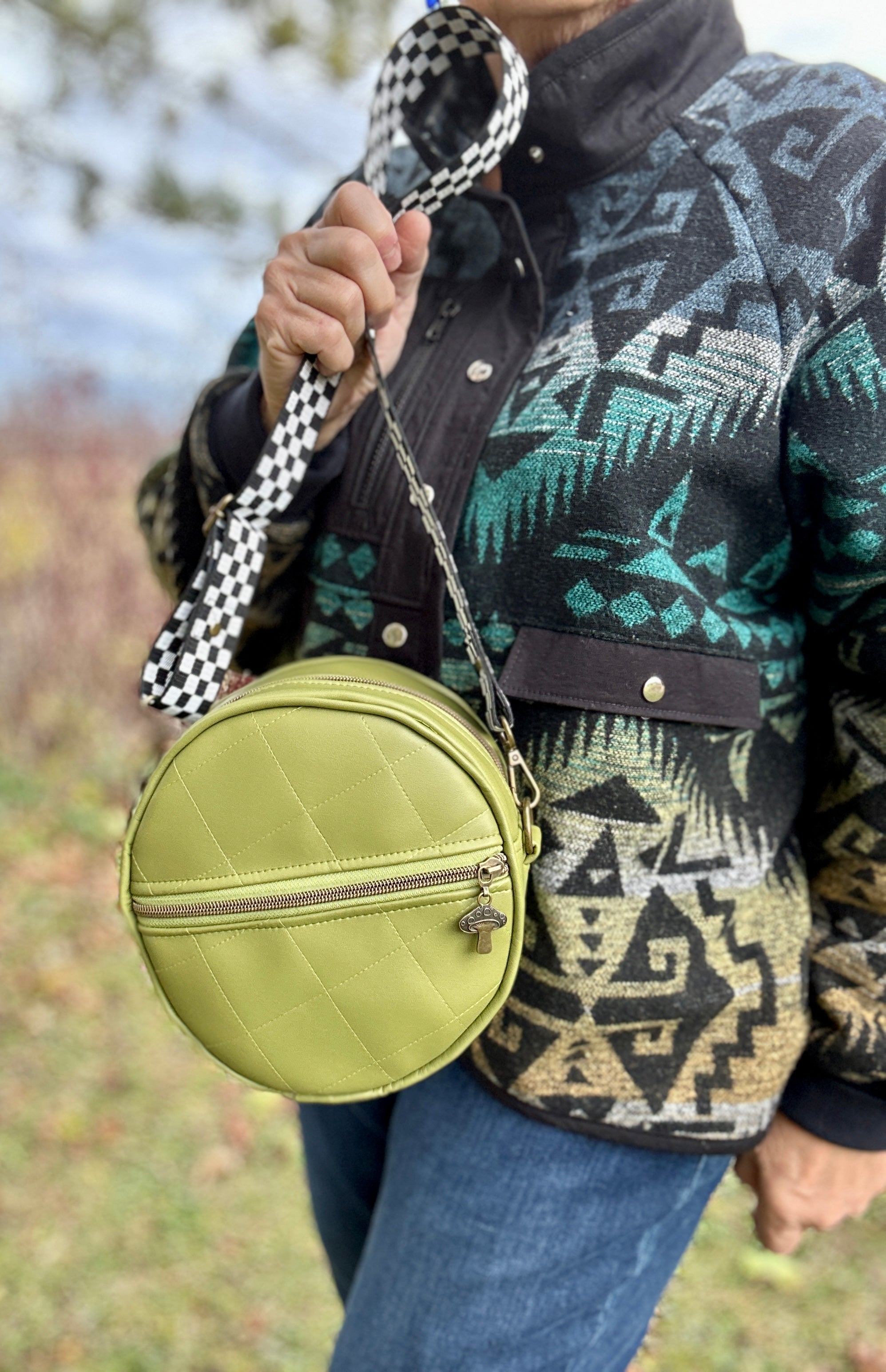 A sewist holding their finished Ellie Essential Round Bag with a smile.