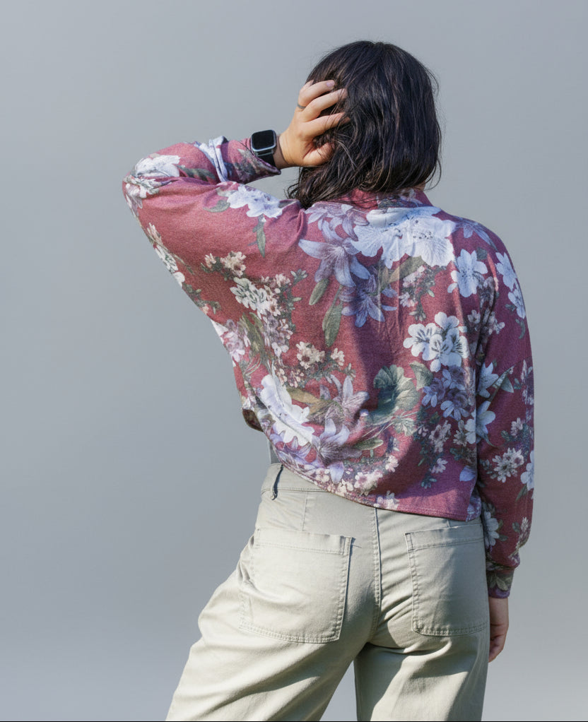 back view of cropped batwing cardigan showing drape. Floral french terry fabric used.