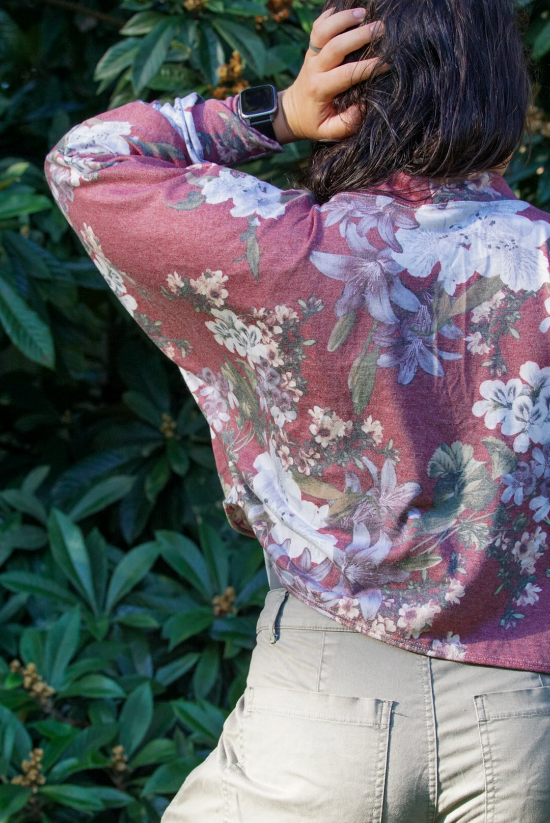 back view of cropped batwing cardigan showing drape. Floral french terry fabric used.