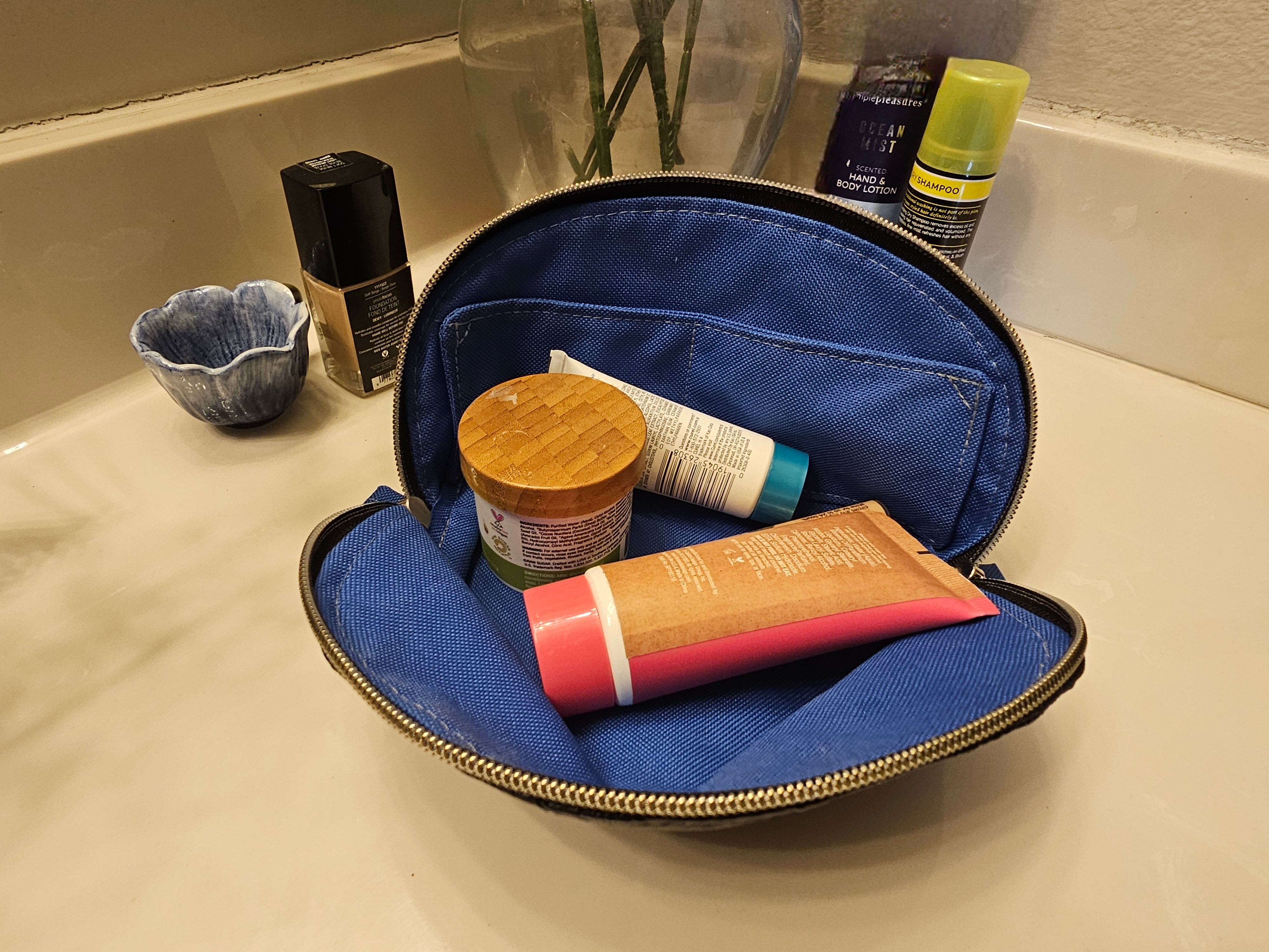 Interior view of the Tessa Toiletry Pouch showing clean lining and slip pocket.
