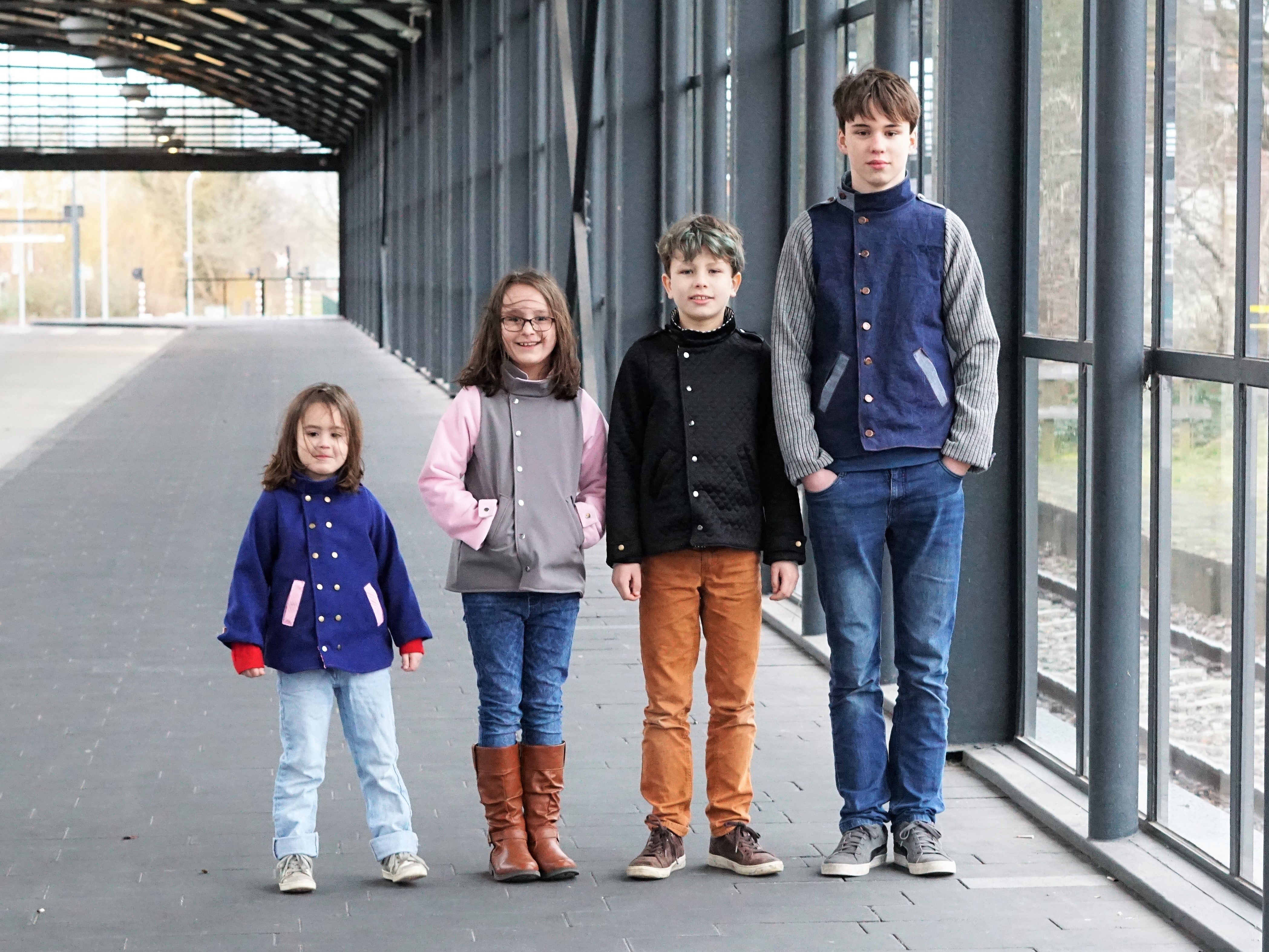 Ellie & Mac Kids Duke Jacket sewing pattern worn by a set of 4 siblings in different fabric.