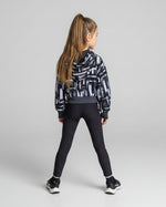 Black and white cropped hooded sweatshirt on a girl. Back view.