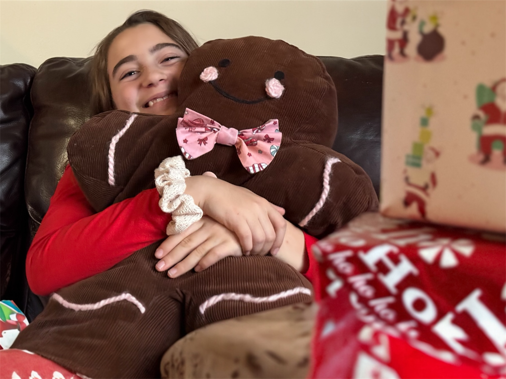 Jolly Gingerbread People pillows styled in a holiday scene for Christmas décor inspiration.