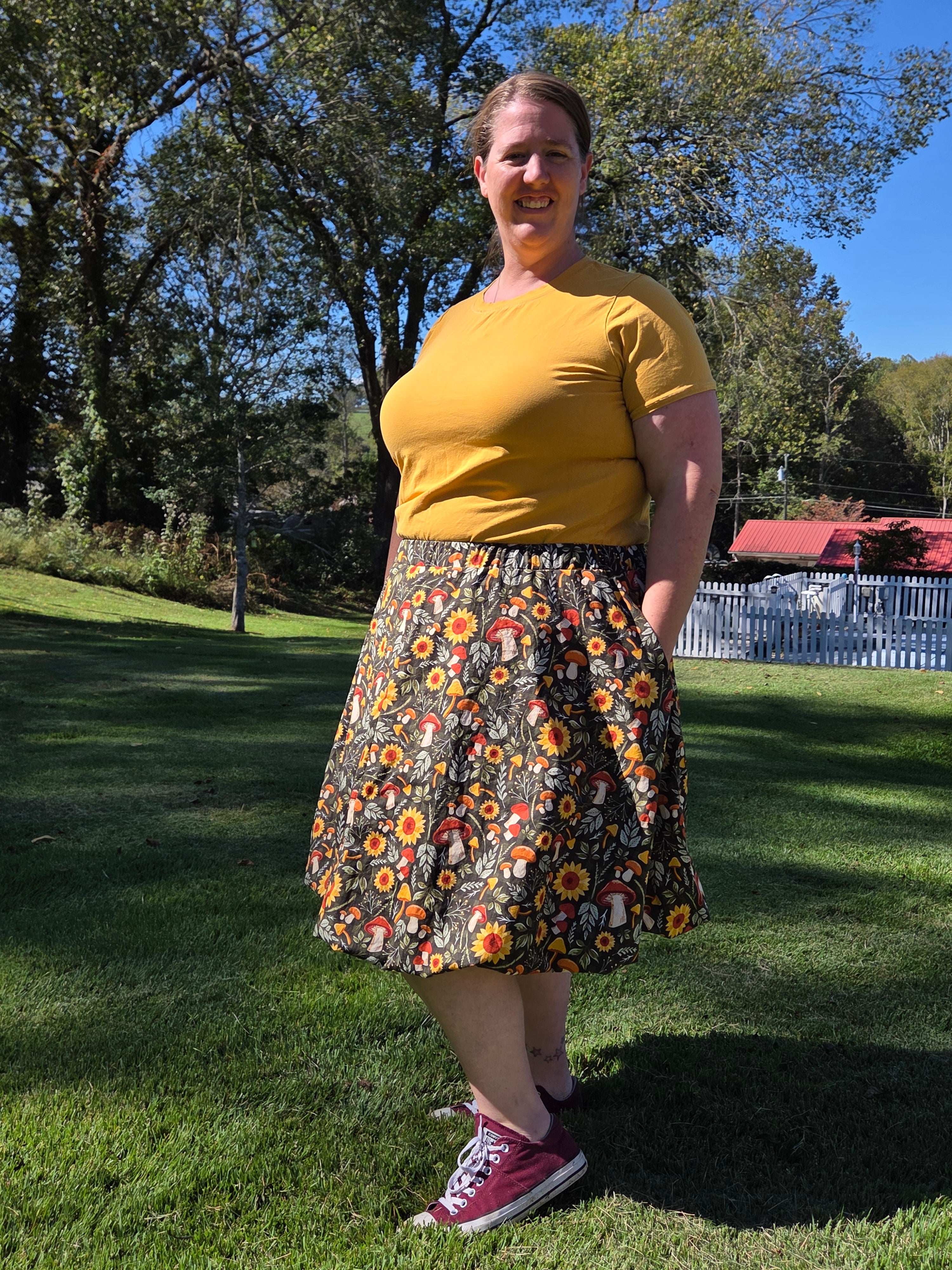 Person wearing a floral bubble skirt outdoors on grass. Made using a PDF sewing pattern.