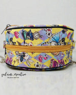 Colorful patterned bag with a yellow zipper on a white background. PDF pattern.