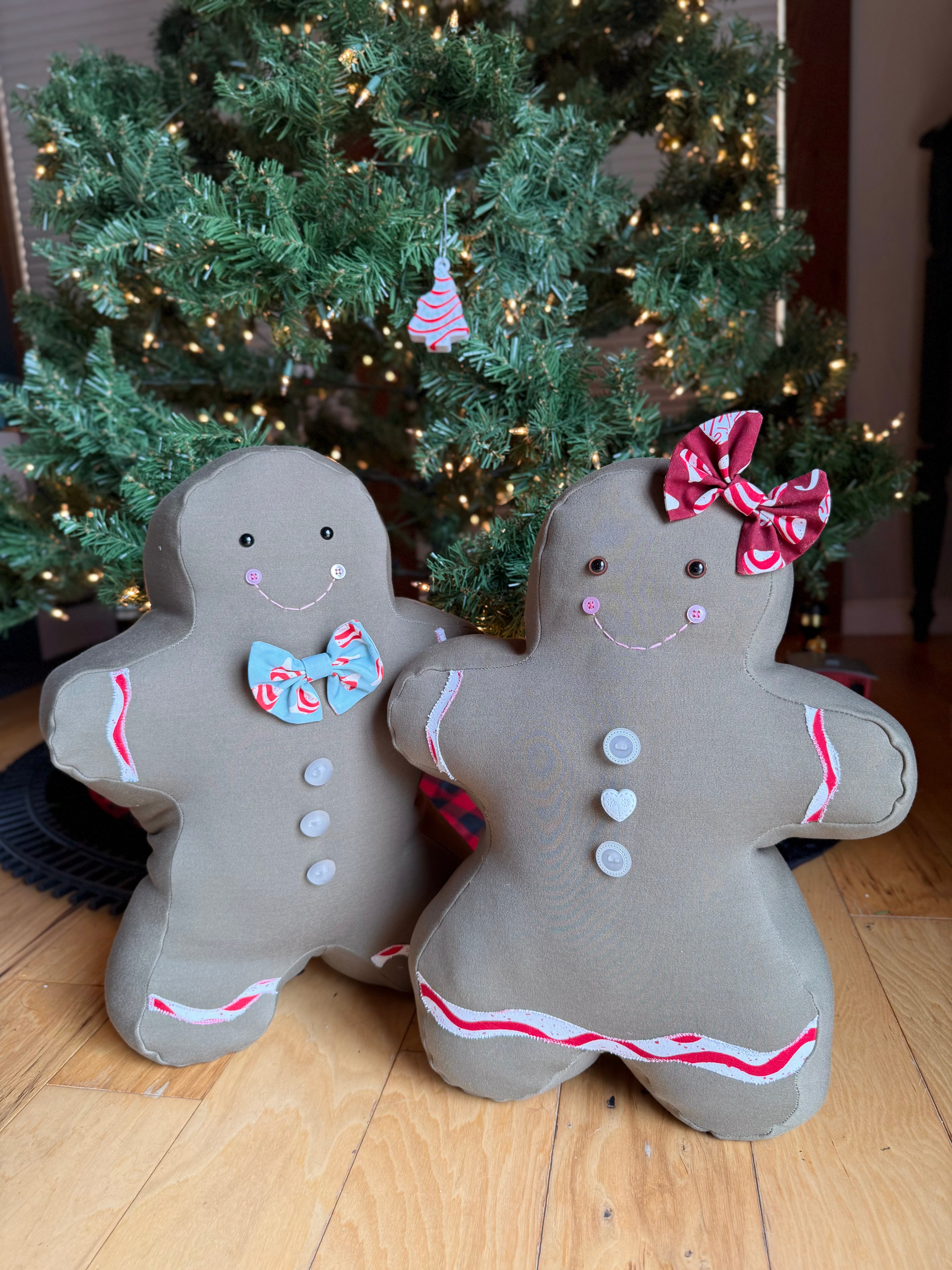 Gingerbread man and woman pillows displayed together from the Jolly Gingerbread People Sewing Pattern.