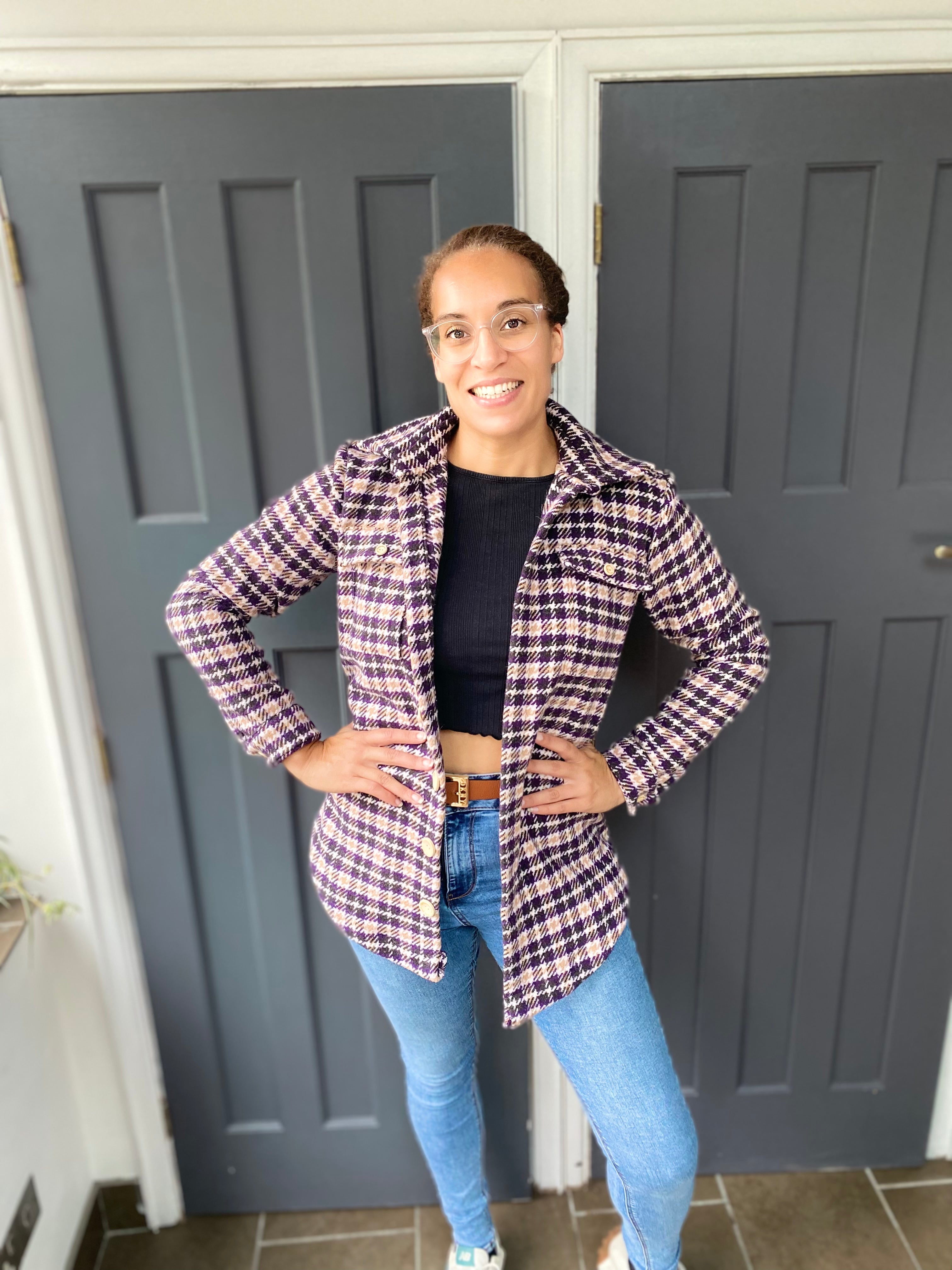 Model smiling in front of a door wearing a hip length shacket made using the Connie Casual Shacket PDF sewing pattern by Ellie and Mac Sewing patterns.