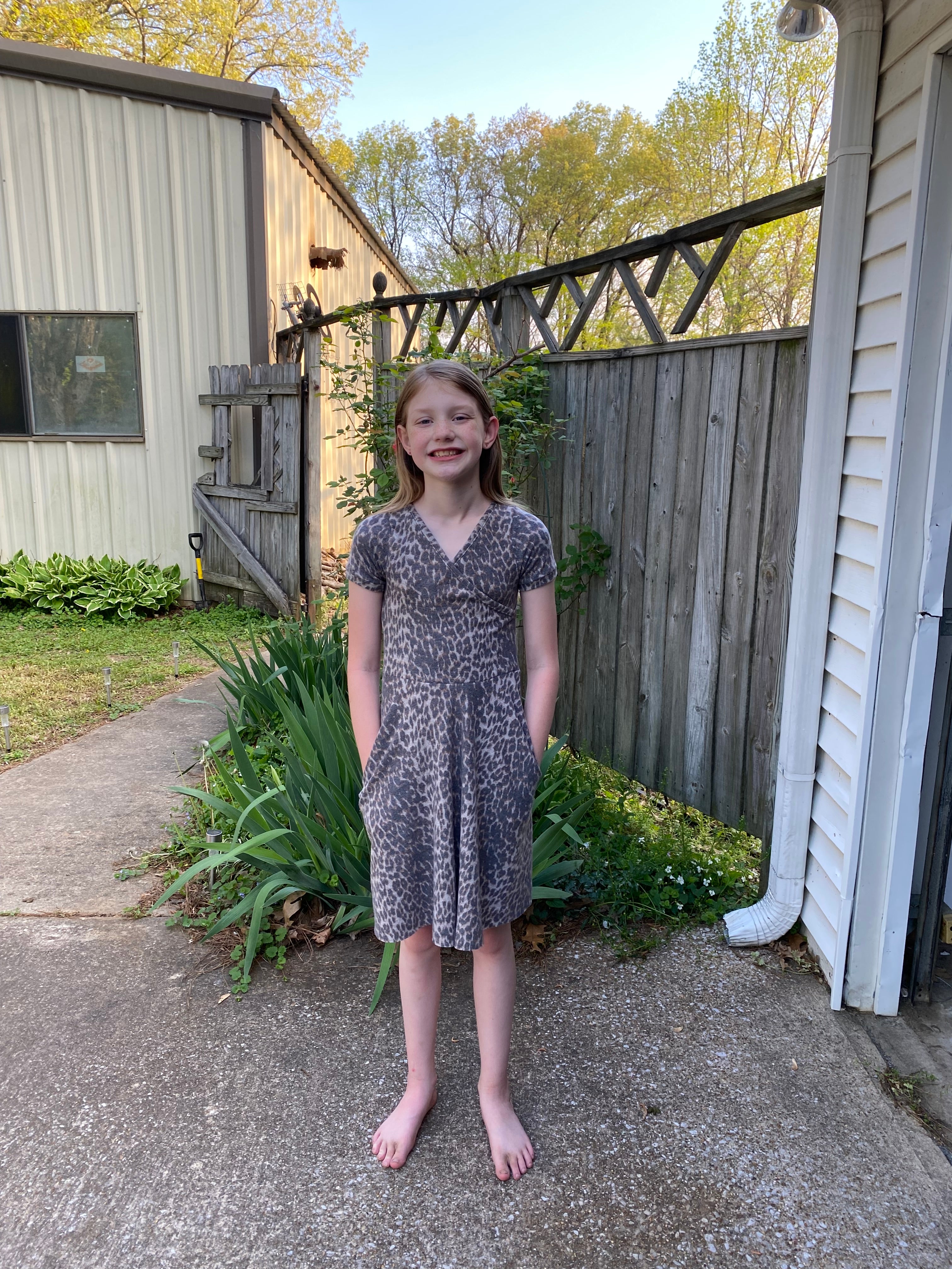 Cheetah print girls dress using Tres Belle dress sewing pattern. 1/2 circle, gathered skirt, maxi skirt, and full circle skirt options.