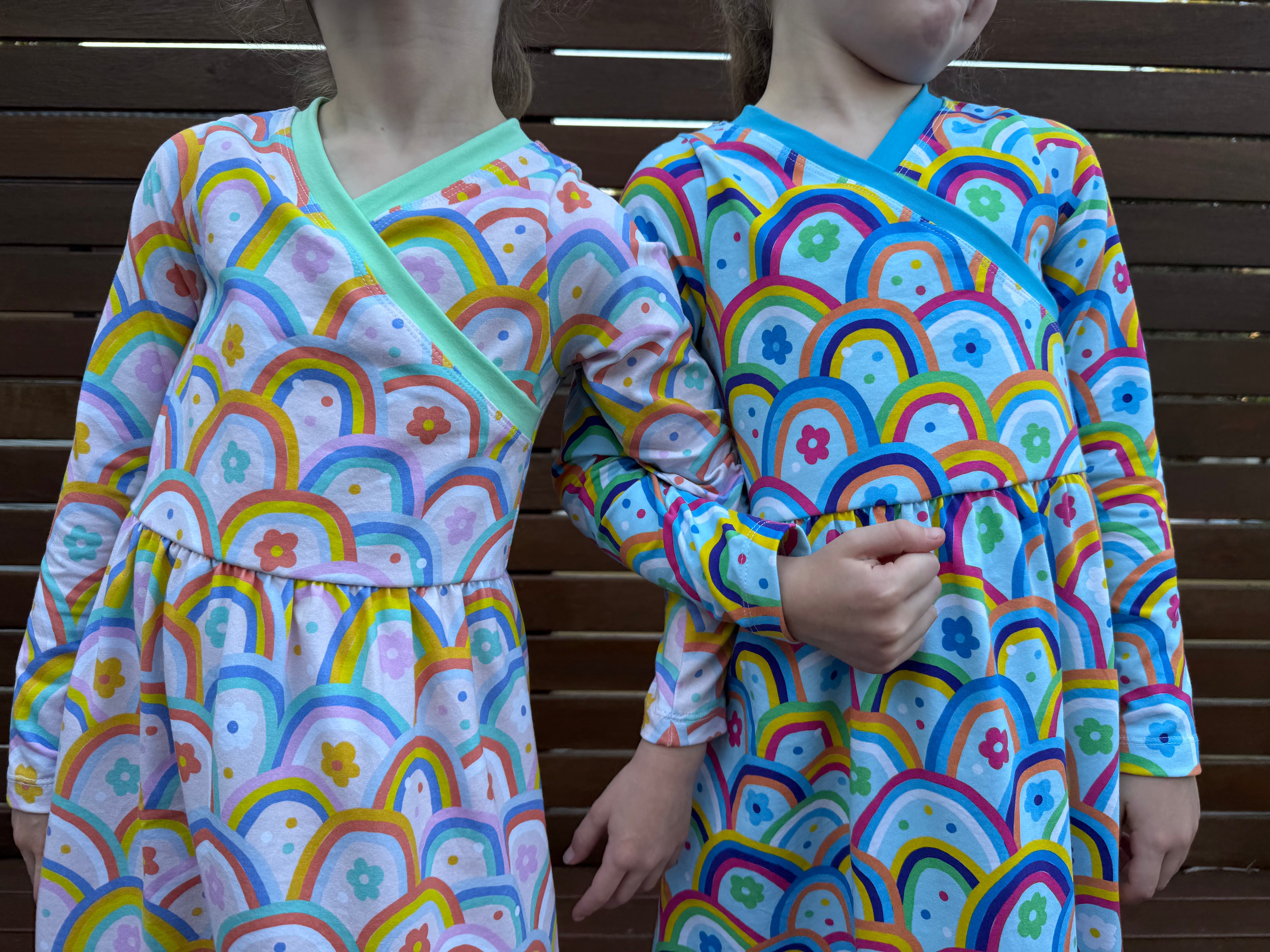 Cute maxi dresses for kids. Easy sewing patterns for beginners. Knit dress pattern. Long sleeves with rainbow fabric. Twinning.