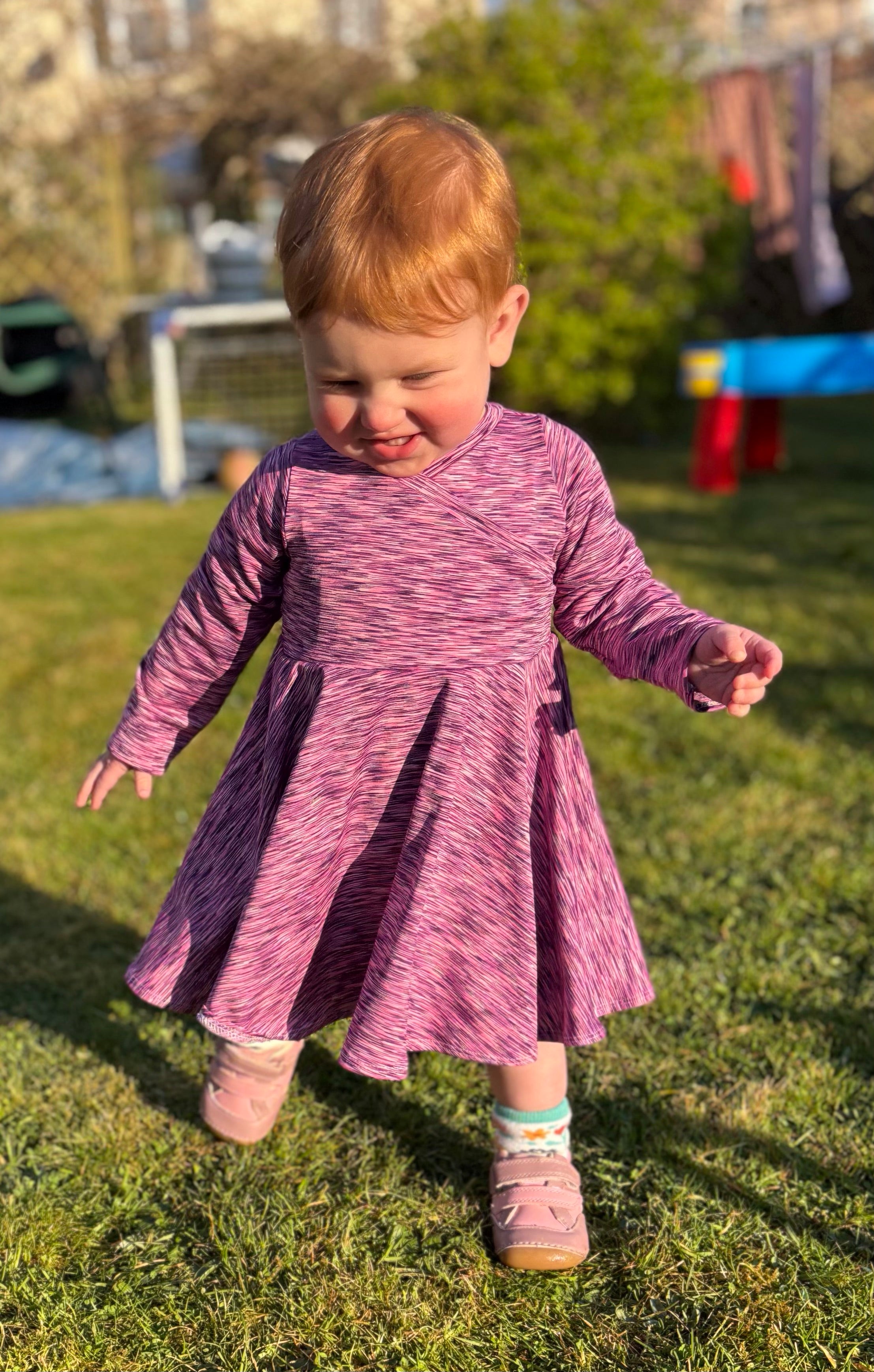 Baby dress sewing pattern. Faux wrap bodice, long sleeves, and a circle skirt. Easy baby sewing patterns. 