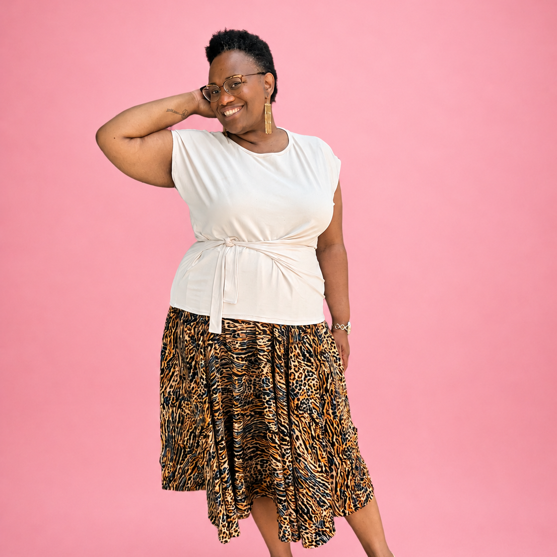 Woman wearing Ellie and Mac Size Inclusive sewing patterns she made. Sizes range from xxs - 6xl and some have 7xl and 8xl. 