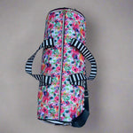 Serena Sports Duffle Bag in a waterproof floral canvas fabric and white and black contrasting bottom panel. Adjustable shoulder straps and hand straps. Side Zipper shoe compartment to keep dirty shoes away from clean clothes. Side mesh pocket for quick access to keys, phone, airpods, and more. Easy PDF sewing pattern by Ellie and Mac Sewing Patterns.
