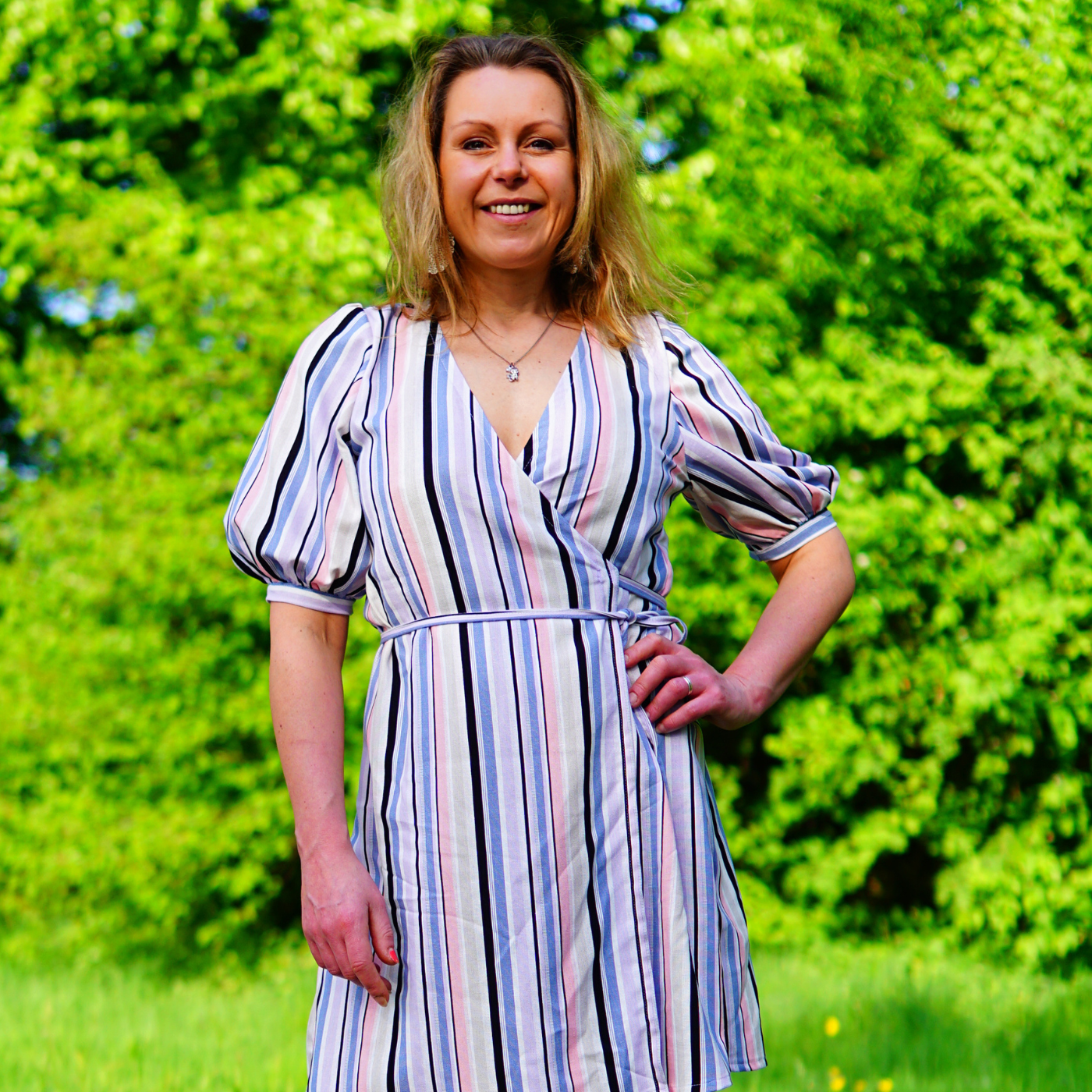 Marieke - Designer Ellie and Mac Sewing Patterns - Wearing a striped puff sleeve wrap dress. 