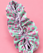 Reusable present bag sewn from colorful fabric with ribbon and handles