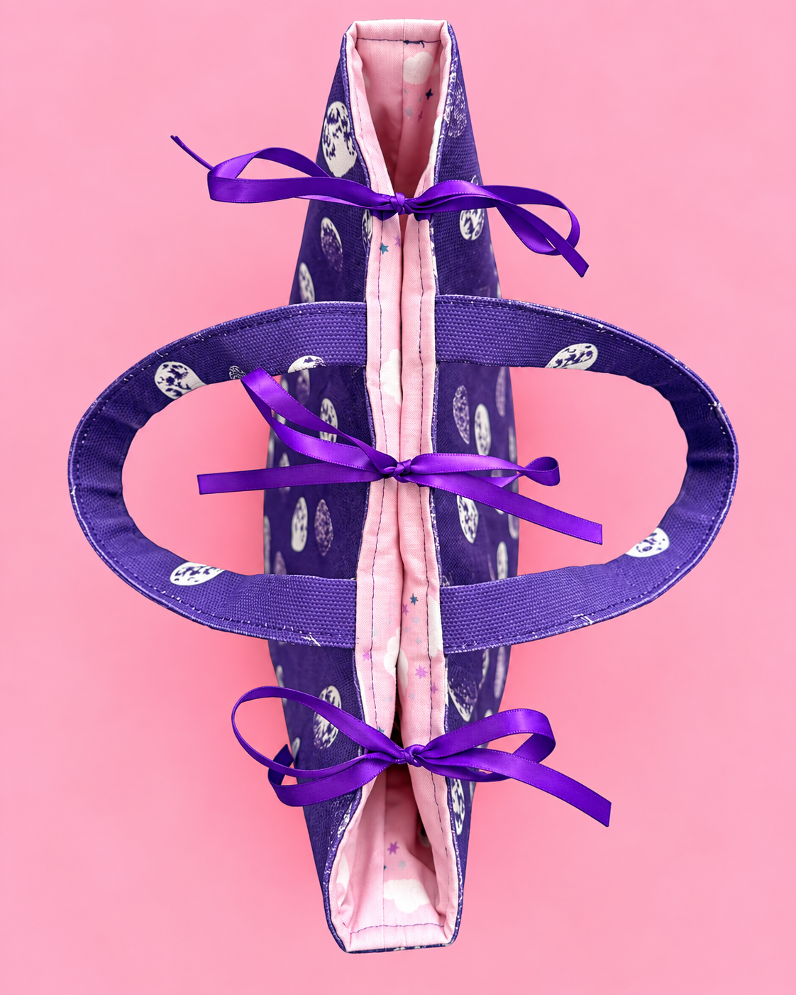 Close-up of a lined fabric gift bag interior with ribbon closure