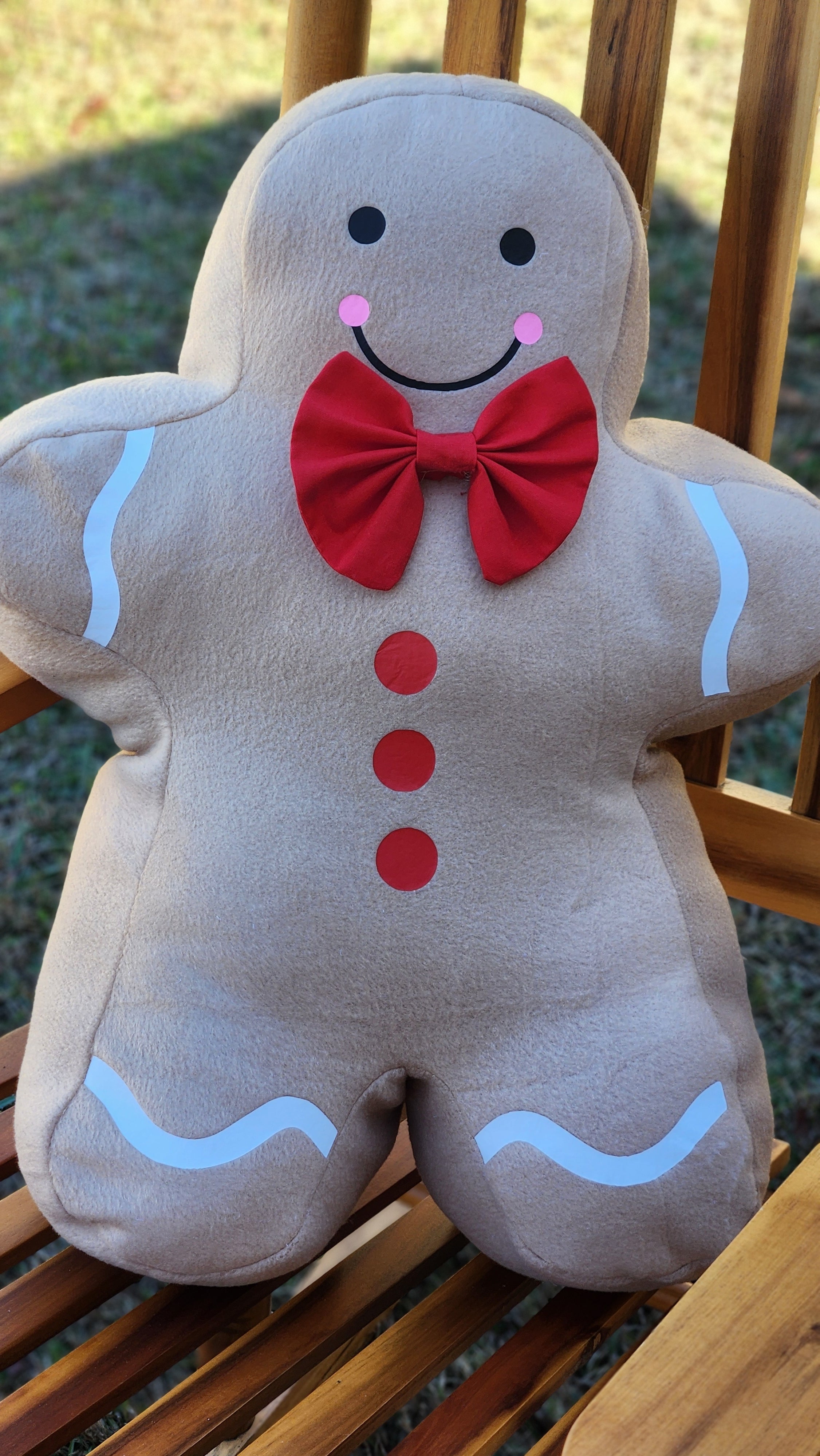 Handmade Gingerbread Man pillow sewn using the Jolly Gingerbread People Sewing Pattern.
