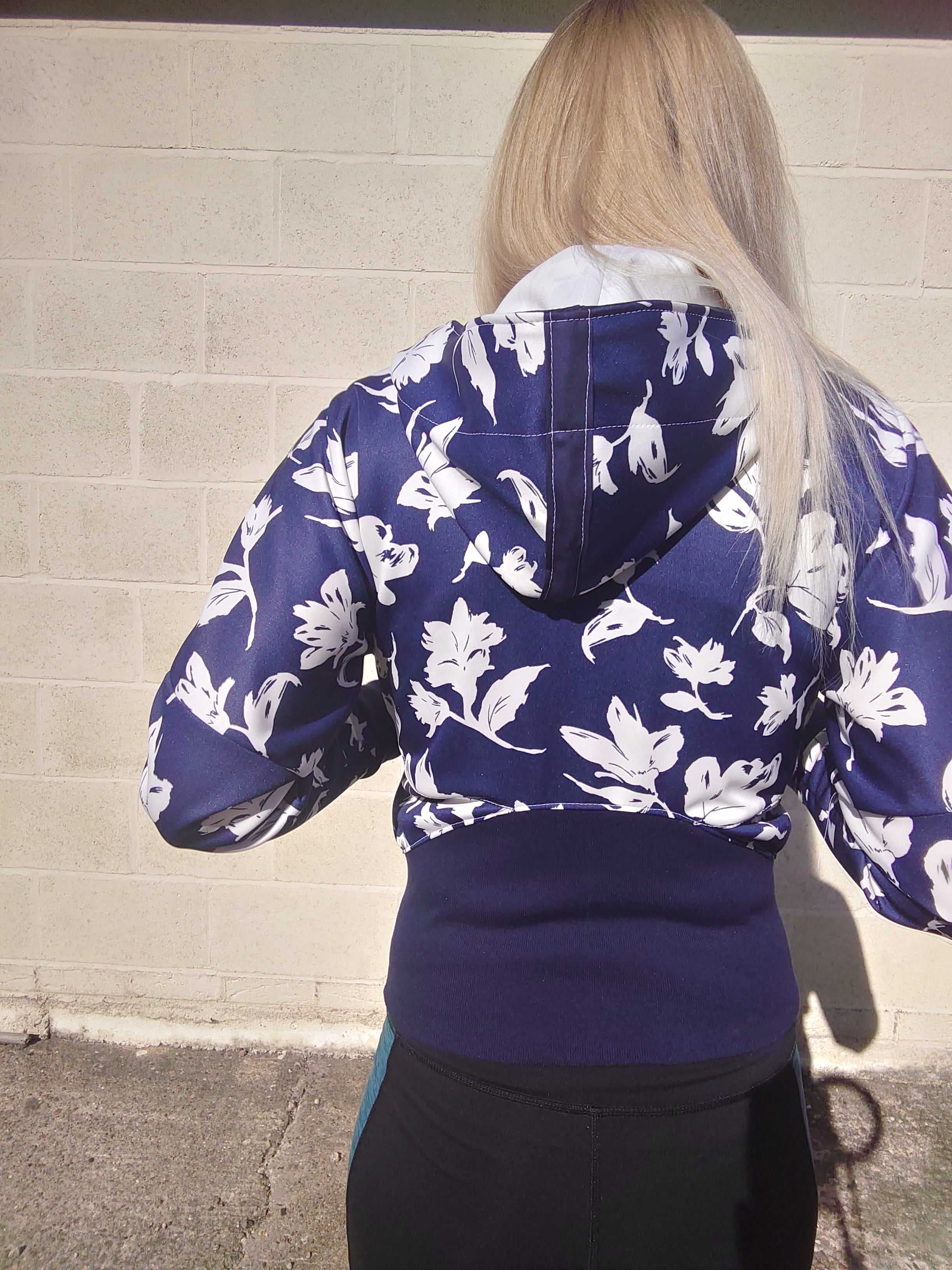 Scuba athletic jacket in navy fabric with white floral print. Curved back waistband and hood. Cool sewing pattern - instant download.