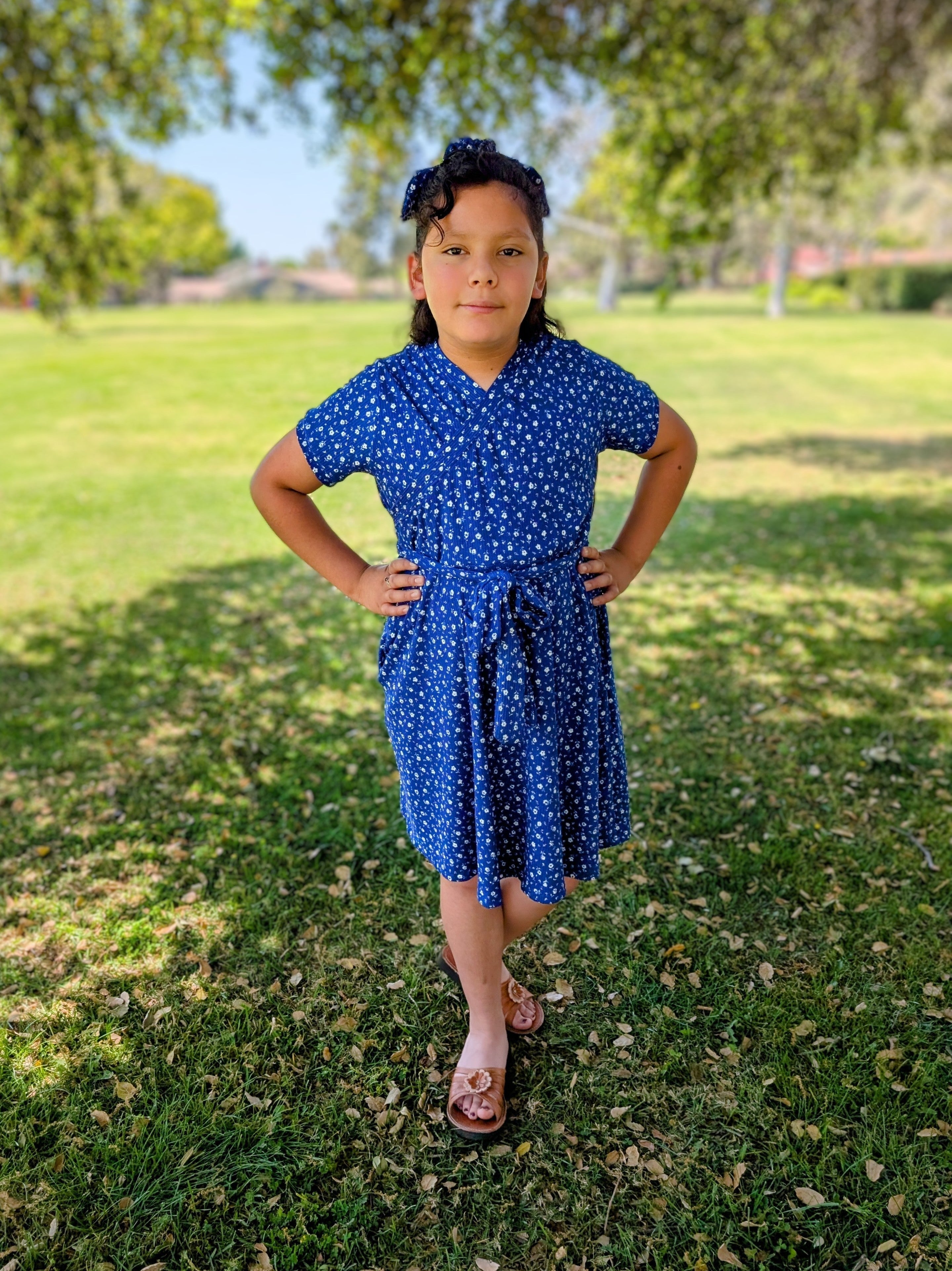 Pretty blue dress with sash and gathered skirt. Sewing pattern for faux wrap bodice. Easy sewing patterns.
