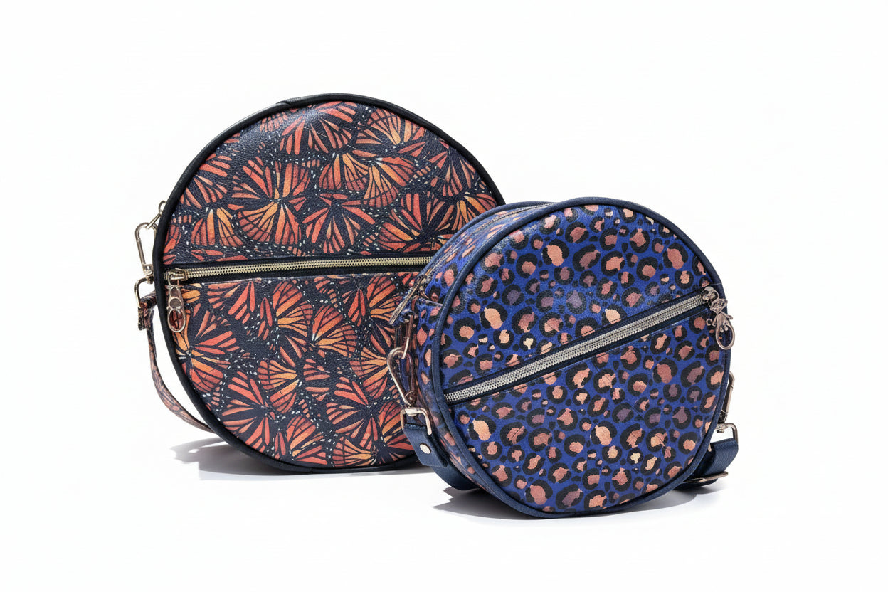 Side-by-side comparison of the Small and Large Ellie Essential Round Bag sizes.