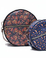 Side-by-side comparison of the Small and Large Ellie Essential Round Bag sizes.