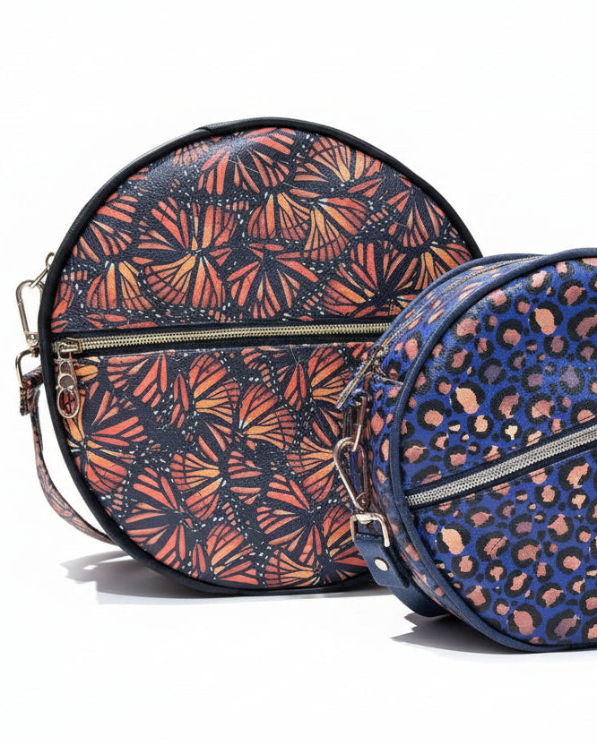 Side-by-side comparison of the Small and Large Ellie Essential Round Bag sizes.