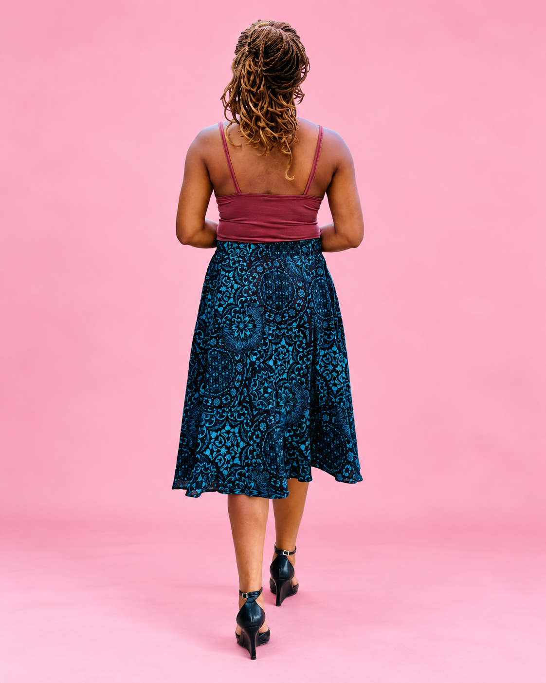 Back view of the Mila woven midi skirt showing the full silhouette