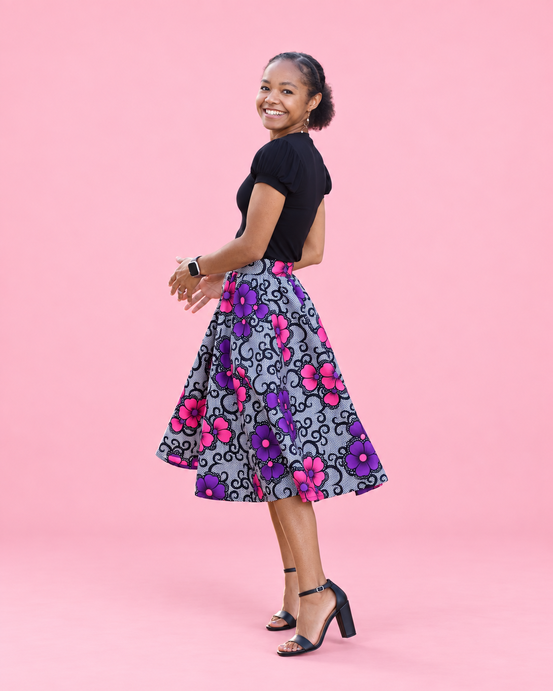 Side view of the Mila woven skirt showing its flowing paneled shape
