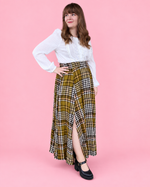 Women's paneled maxi skirt sewing pattern with a flowing silhouette and front slit.