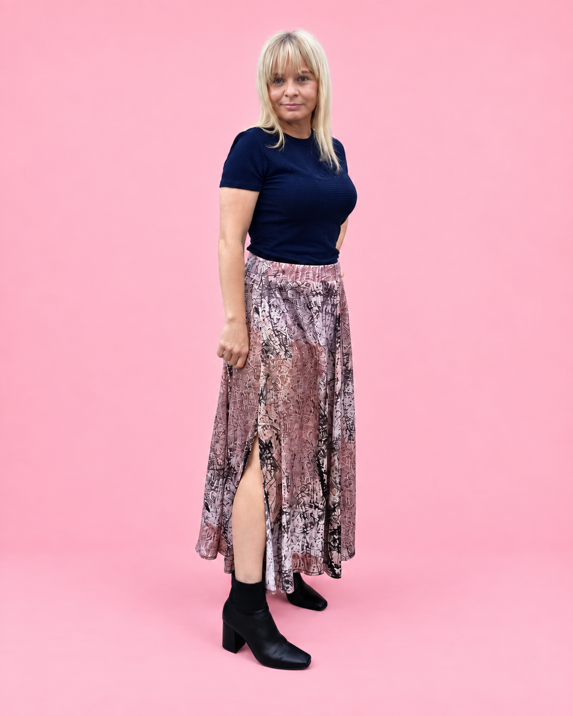 Side view of the Mila woven skirt showing its flowing paneled shape