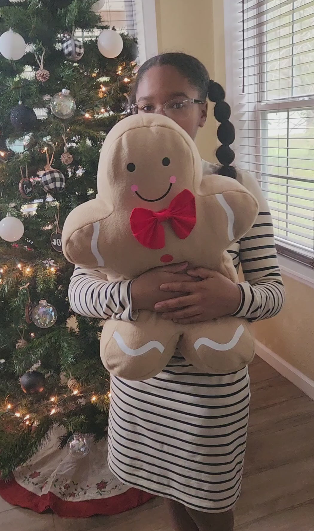 Jolly Gingerbread People pillows styled in a holiday scene for Christmas décor inspiration.