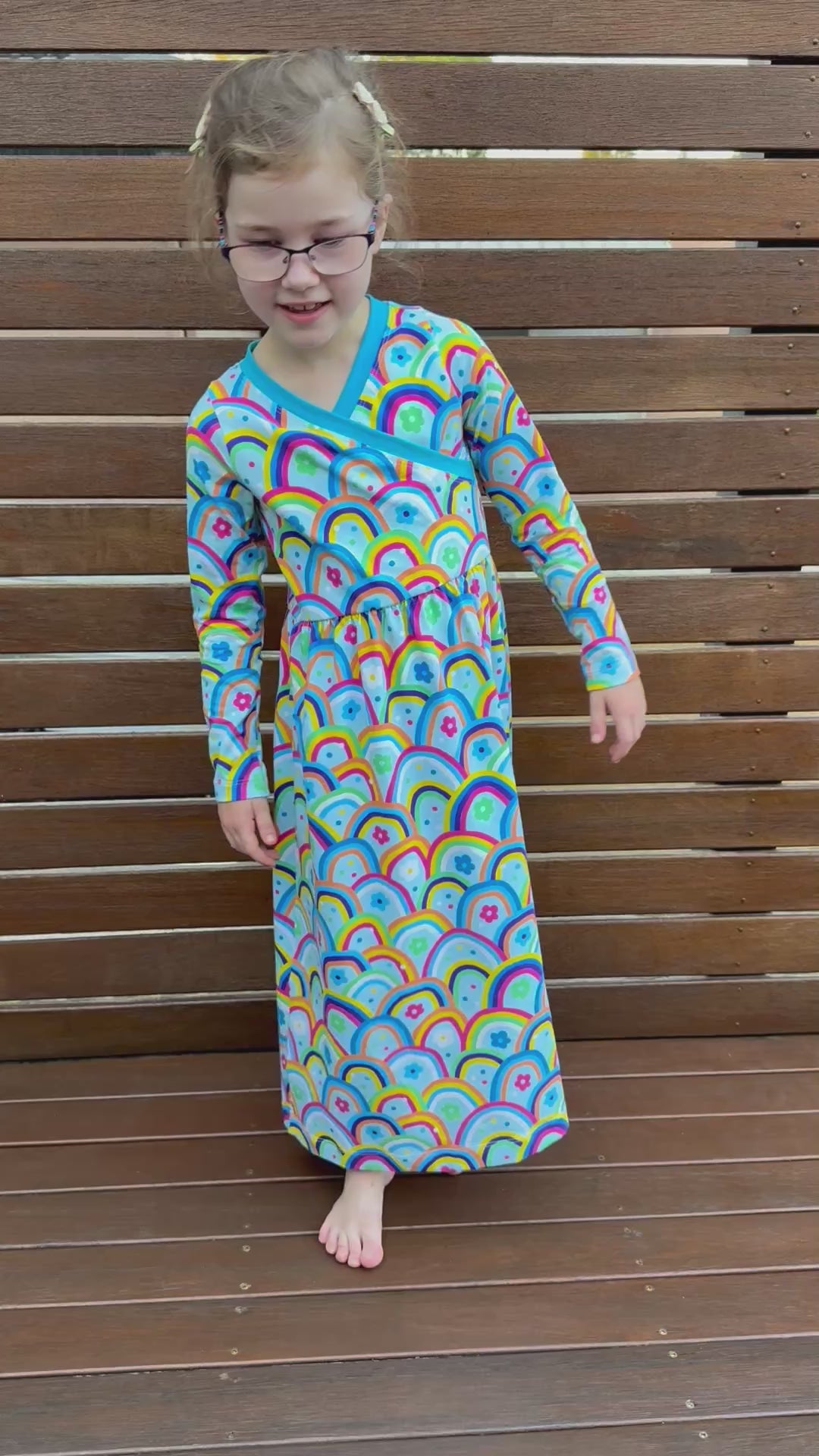 Cute maxi dress for kids. Easy sewing patterns for beginners. Knit dress pattern. Long sleeves with rainbow fabric.