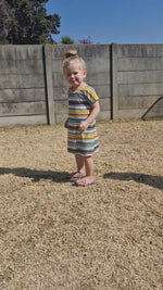 girl in striped dolman dress twirling.