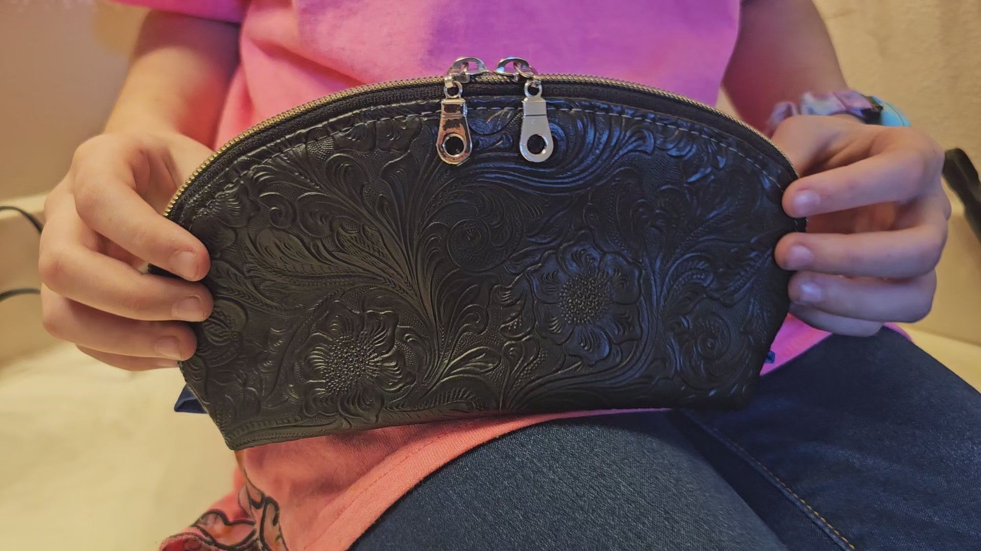 Tessa Toiletry Pouch shown opened and filled to demonstrate interior space and functionality.