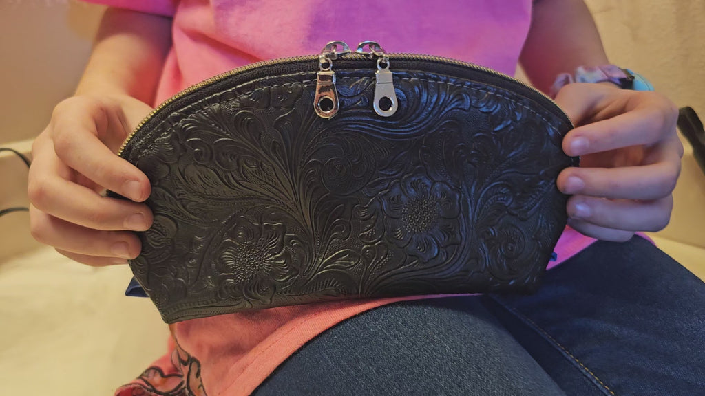 Tessa Toiletry Pouch shown opened and filled to demonstrate interior space and functionality.