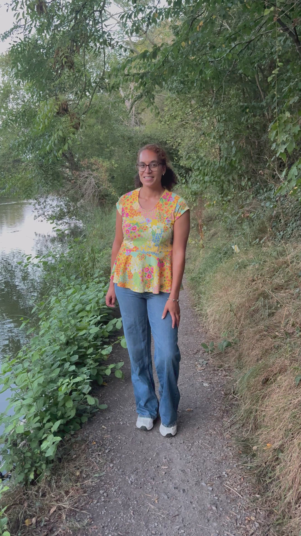 Woman modeling the Petunia Princess Seam Peplum sewing pattern by Ellie and Mac PDF sewing patterns.