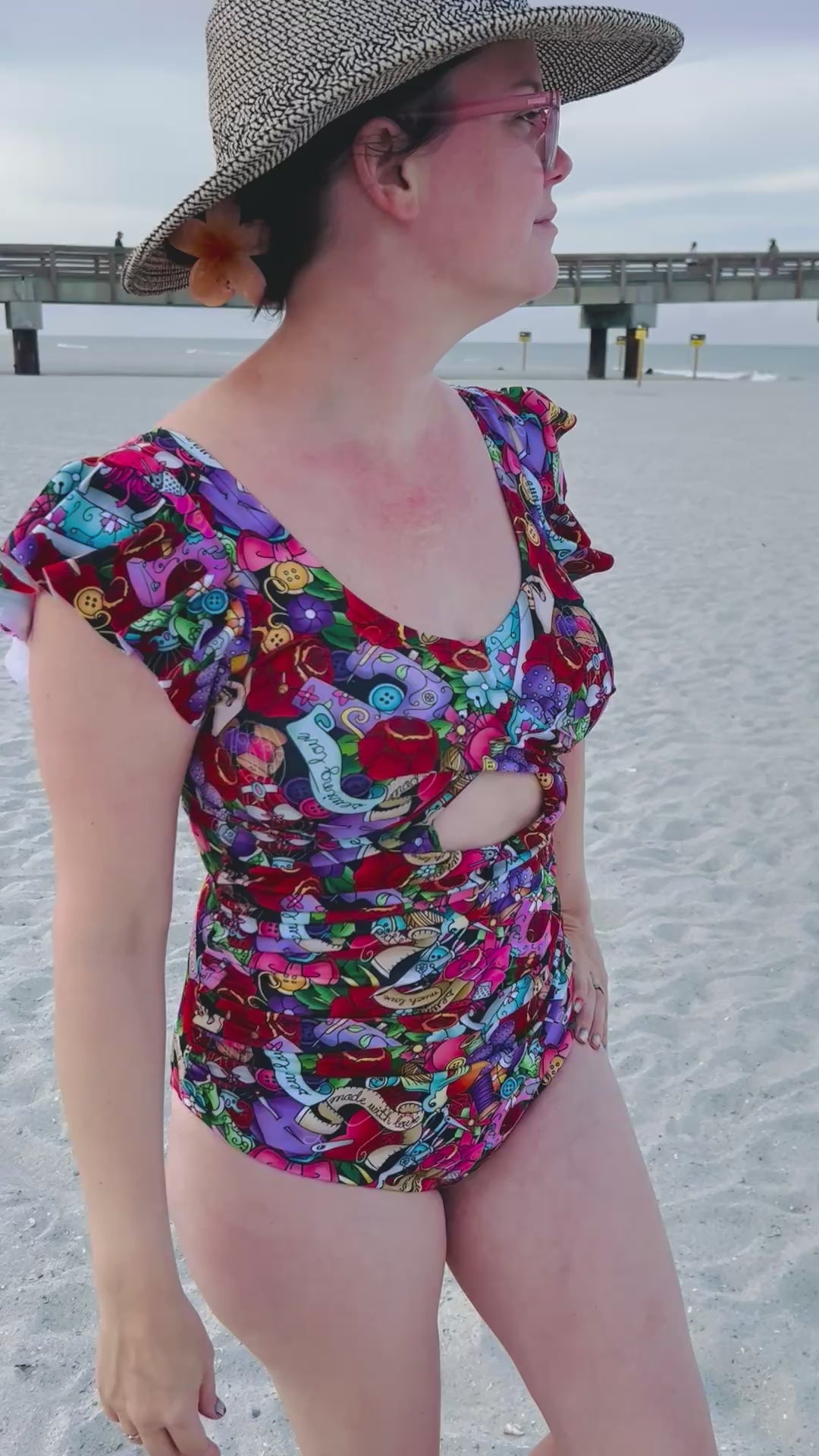 The swimsuit was made with the tropical twist swimsuit pdf sewing pattern. It features cut outs in front and back. 