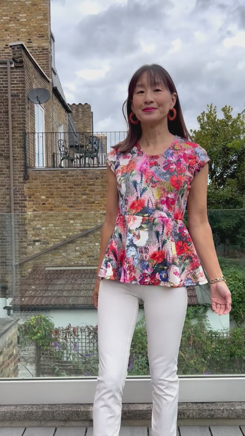 Woman modeling the Petunia Princess Seam Peplum sewing pattern by Ellie and Mac PDF sewing patterns.