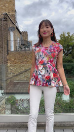 Woman modeling the Petunia Princess Seam Peplum sewing pattern by Ellie and Mac PDF sewing patterns.