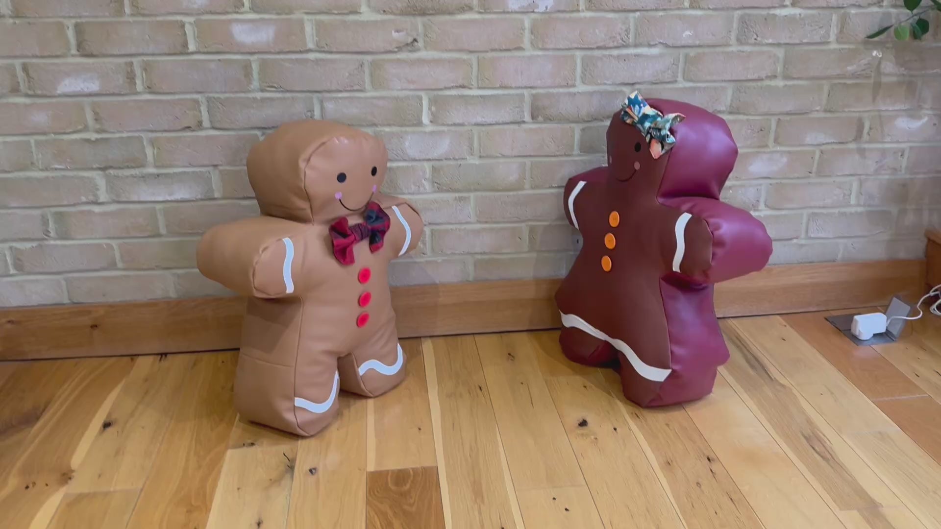 Jolly Gingerbread pillows displayed in a child’s room as playful holiday décor.