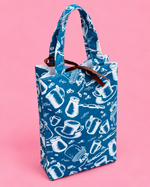 Handmade fabric gift bag with colorful floral print and decorative tulle