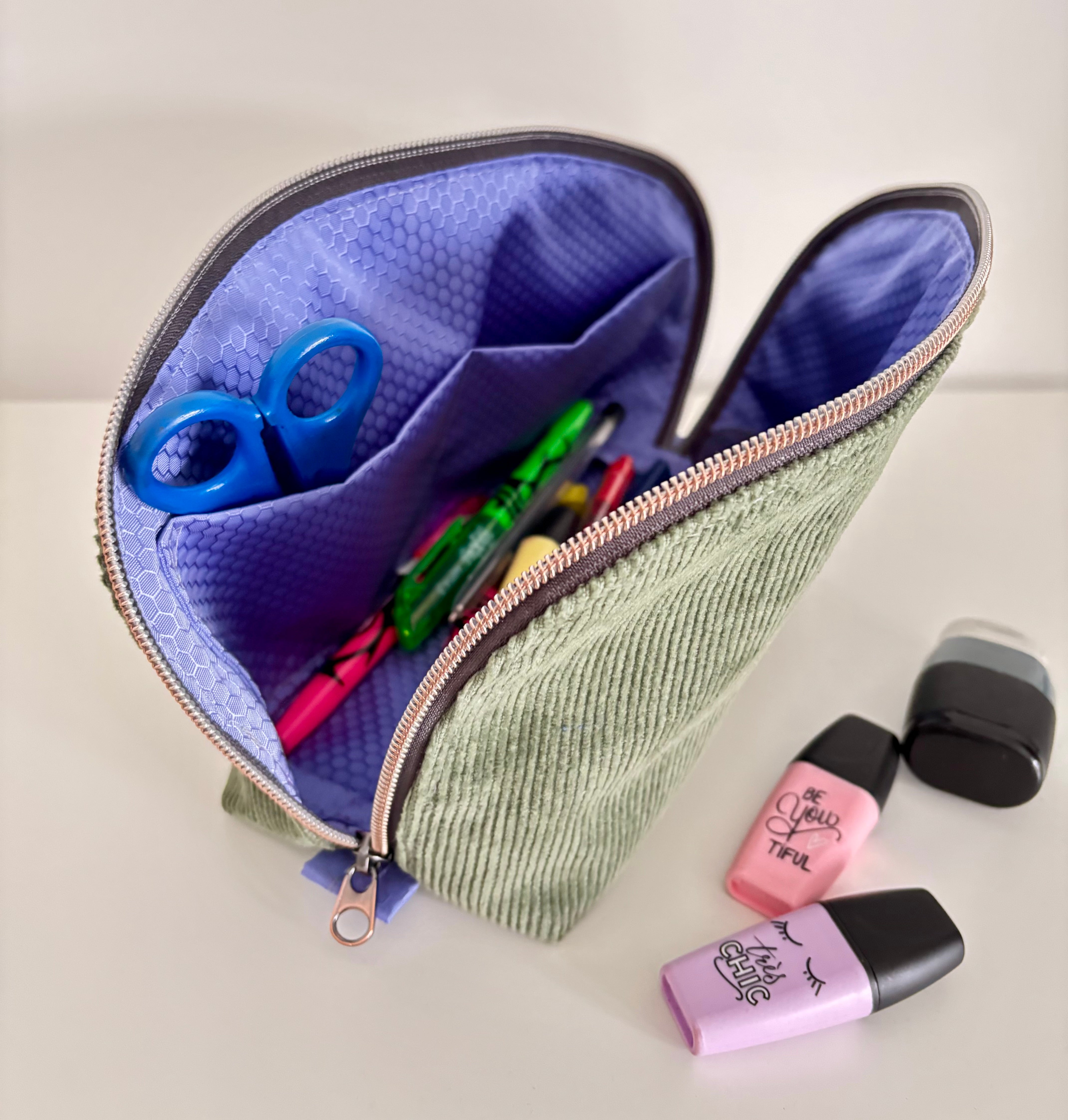 Zipper pouch styled on a bedside table showing everyday usability.