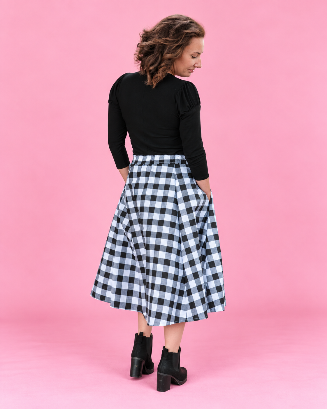 Mila woven midi skirt sewing pattern with a full flowing shape. Back view.