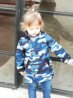 Girl wearing a blue camo jacket made from Ellie & Mac Kids Duke Jacket sewing pattern